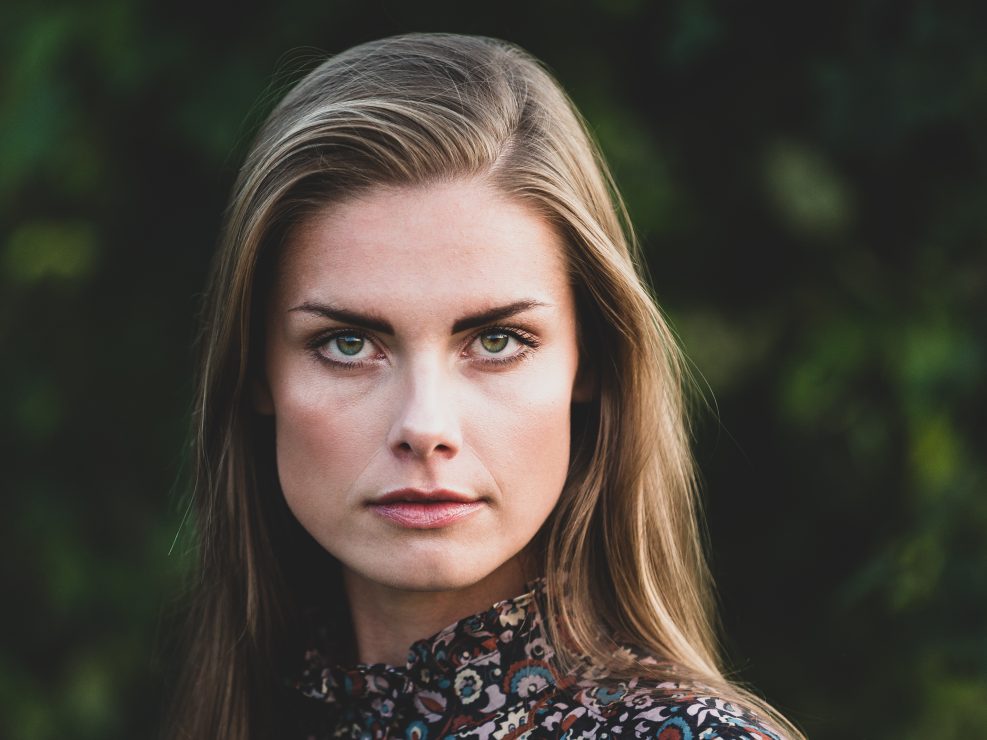Woman with long hair outdoors.